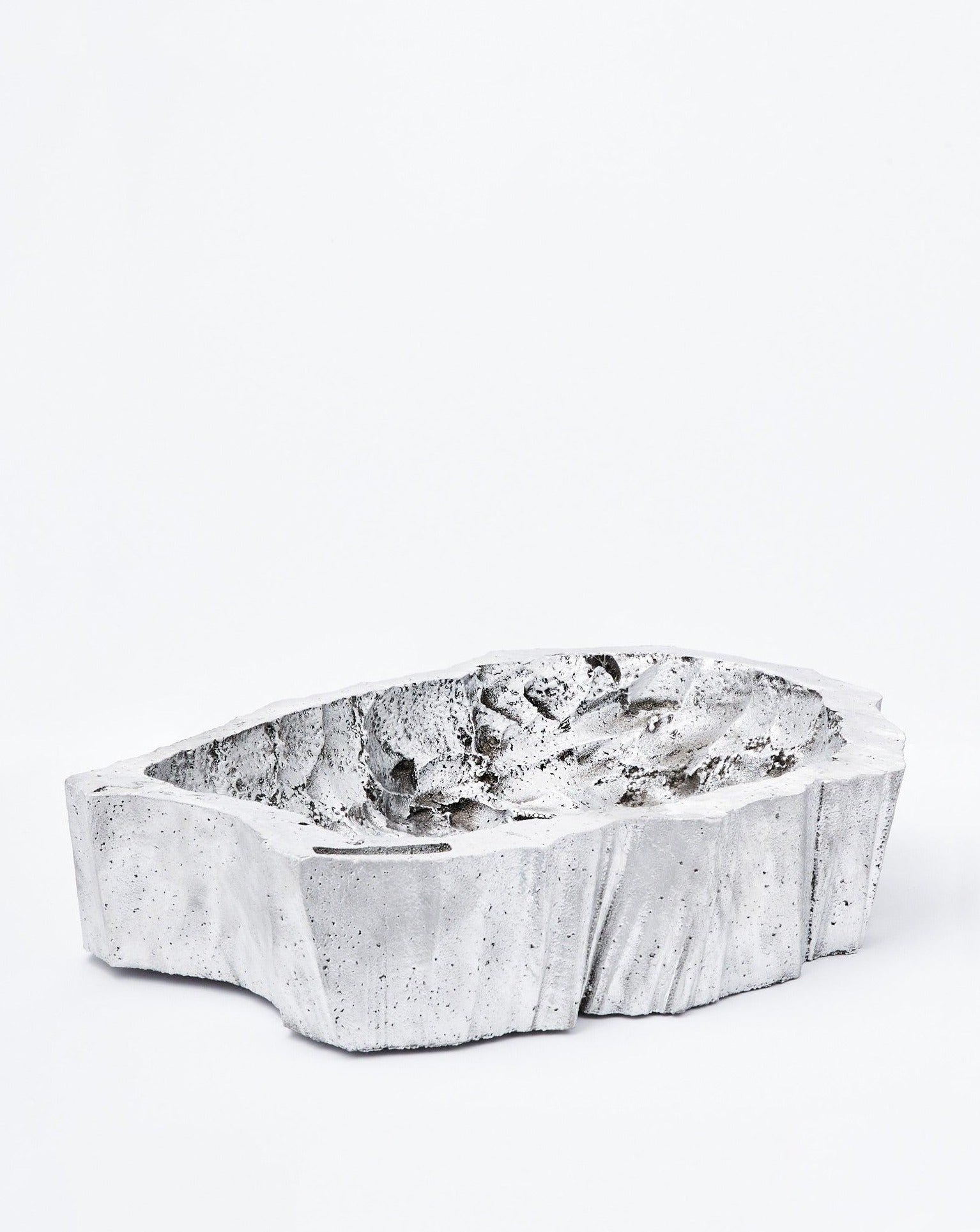 White background, scooped bucket tilting to the left